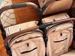 Strolee V2 Double Lightweight Stroller Beige Adjustable Handles Black Wheels. Fixed Price $450.00.