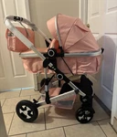 Pink Single Carriage Stroller Adjustable Handles Reversible Forward/rear Facing. Fixed Price $155.00.