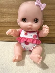 Berenguer Baby Doll Lil Cutie 06-14 Brown Eyes Pink Bow And Bathing Suit. Fixed Price $8.00.