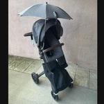 Stokke Xplory Stroller In Black Melange With Silver Frame Brown Handle. Fixed Price $375.00.