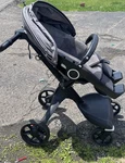 Stokke Single Stroller Gray/black W/ Canopy Hood & Adjustable Handles. Fixed Price $201.01.