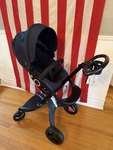 Stokke Xplory Black Stroller System Bassinet Seat Five-point Harness Accessories. Fixed Price $850.00.
