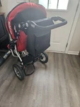 Bebelove Deluxe Single Jogging Stroller With Front Swivel Wheel Red. Fixed Price $200.00.
