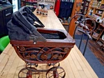 Vintage Wicker Doll Carriage With Metal Frame And Folding Fabric Hood. Fixed Price $55.00.