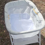 Graco Portable Bassinet Gray White Mesh Sides Mattress Pad Storage Shelf. Fixed Price $31.50.