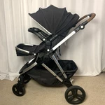Mockingbird 2.0 Black Stroller Brown Handle Single Seat With Snack Tray. Fixed Price $200.00.