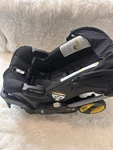 Doona Infant Car Seat Stroller System Black Rear Facing Fold-away Sun Canopy. Fixed Price $350.00.