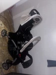 Baby Trend Sit N' Stand Travel Double Stroller W/ Single Car Seat, Magnolia. Fixed Price $325.00.